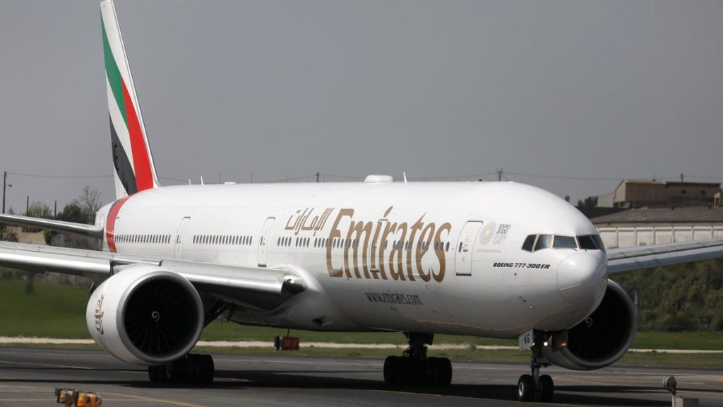 An emirates airlines boeing 777 plane prepares to take off at lisbon s airport
